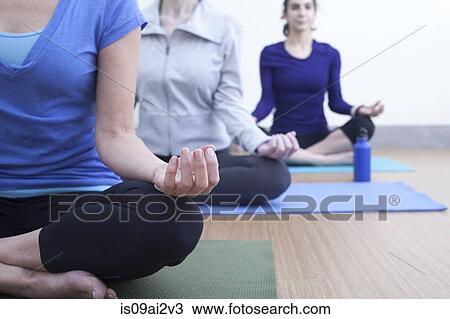 Women in lotus pose View Large Photo Image Stock Image - Women in lotus pose. Fotosearch
