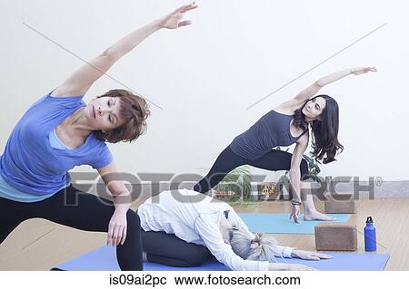 Women practising yoga View Large Photo Image Stock Image - Women practising yoga. Fotosearch