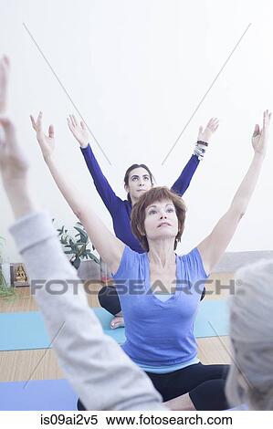 Women practising yoga View Large Photo Image Stock Photography - Women practising yoga. Fotosearch