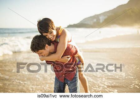 Young couple enjoying sunset, Ipanema Beach, Rio, Brazil View Large Photo Image Stock Image - Young couple enjoying sunset, Ipanema Beach, Rio, Brazil. Fotosearch