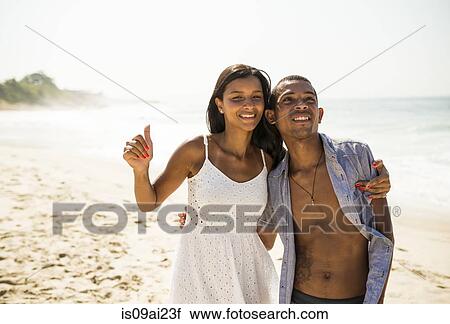Young couple on Arpoador beach, Rio De Janeiro, Brazil View Large Photo Image Stock Image - Young couple on Arpoador beach, Rio De Janeiro, Brazil. Fotosearch