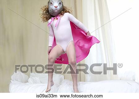 Young girl dressed up as a rabbit princess dancing on bed View Large Photo Image Picture - Young girl dressed up as a rabbit princess dancing on bed. Fotosearch