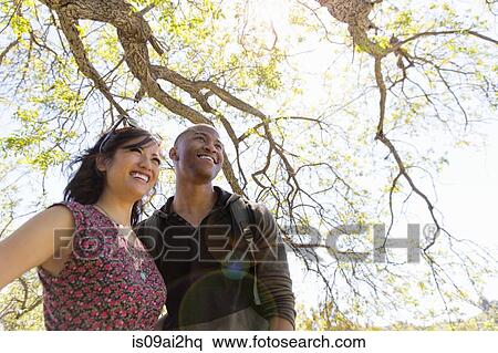 Stock Photography - Young romantic couple in park. Fotosearch