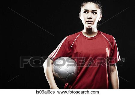 Young woman holding football View Large Photo Image Stock Photograph - Young woman holding football. Fotosearch