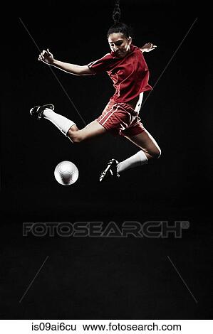 Young woman jumping for football View Large Photo Image Stock Photograph - Young woman jumping for football. Fotosearch