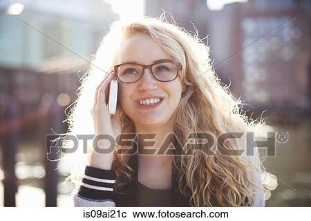 Young woman on phonecall View Large Photo Image Stock Image - Young woman on phonecall. Fotosearch