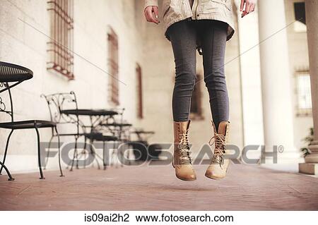 Young woman waist down jumping next to sidewalk cafe View Large Photo Image Stock Image - Young woman waist down jumping next to sidewalk cafe. Fotosearch