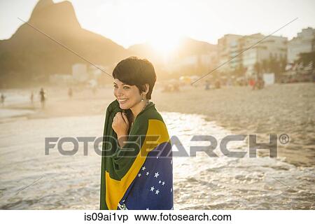 Young woman wrapped in Brazilian flag, Ipanema beach, Rio, Brazil View Large Photo Image Stock Photography - Young woman wrapped in Brazilian flag, Ipanema beach, Rio, Brazil. Fotosearch