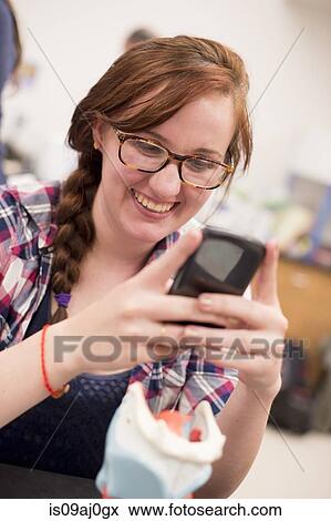 Biology student photographing anatomical model View Large Photo Image Stock Photo - Biology student photographing anatomical model. Fotosearch