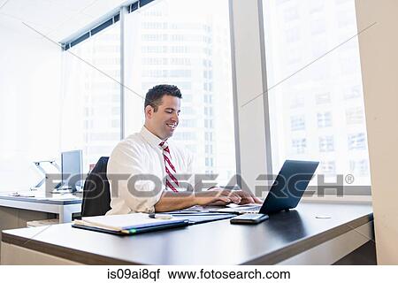 Business lawyer using laptop in office View Large Photo Image Stock Image - Business lawyer using laptop in office. Fotosearch