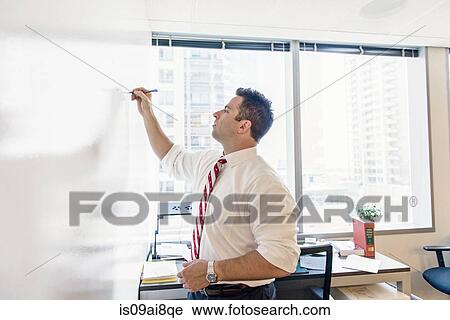 Business lawyer writing on whiteboard in office meeting View Large Photo Image Stock Image - Business lawyer writing on whiteboard in office meeting. Fotosearch