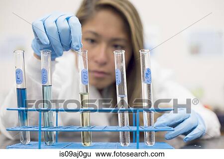 Stock Photograph - Chemistry student with test tubes. Fotosearch