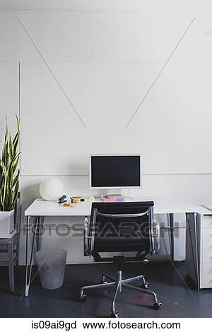 Stock Image - Clean, simple and modern desk space. Fotosearch