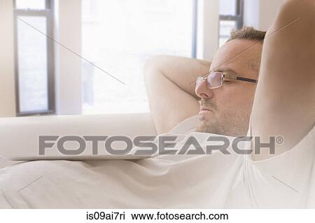 Close up of mature man asleep on sofa View Large Photo Image Stock Image - Close up of mature man asleep on sofa. Fotosearch