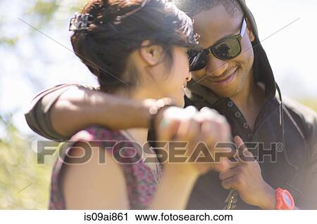 Close up of romantic young couple holding hands View Large Photo Image Stock Image - Close up of romantic young couple holding hands. Fotosearch