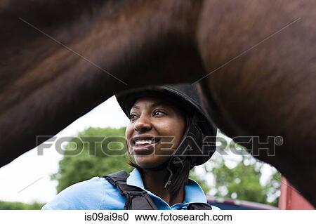 Close up of young woman with horse View Large Photo Image Stock Image - Close up of young woman with horse. Fotosearch