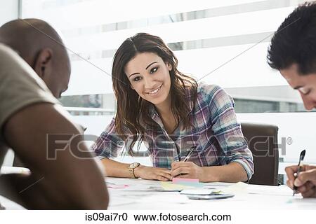 Cropped image of business team working around office desk View Large Photo Image Stock Image - Cropped image of business team working around office desk. Fotosearch