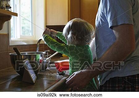 Father and daughter baking View Large Photo Image Stock Image - Father and daughter baking. Fotosearch