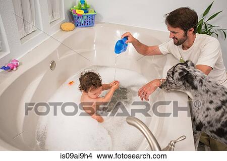 Father playing with toddler daughter in bath View Large Photo Image Picture - Father playing with toddler daughter in bath. Fotosearch