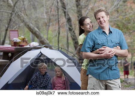 Mature couple and three children on campsite, Sedona, Arizona, USA View Large Photo Image Stock Photo - Mature couple and three children on campsite, Sedona, Arizona, USA. Fotosearch