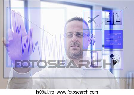 Stock Photography - Mature man using interactive computer touchscreen. Fotosearch
