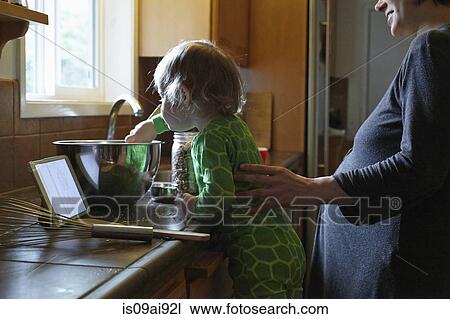 Mother and daughter baking View Large Photo Image Stock Image - Mother and daughter baking. Fotosearch