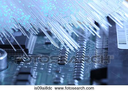Stock Image - Optical fiber and electronic component. Fotosearch