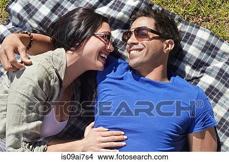 Overhead view of couple on picnic blanket View Large Photo Image Picture - Overhead view of couple on picnic blanket. Fotosearch