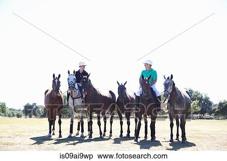 Polo players, leading horses in from field View Large Photo Image Stock Photography - Polo players, leading horses in from field. Fotosearch