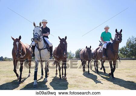Polo players, leading horses in from field View Large Photo Image Stock Photography - Polo players, leading horses in from field. Fotosearch