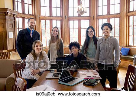 Stock Image - Portrait of college students with teacher. Fotosearch