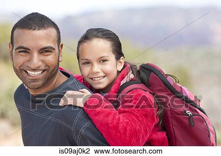 Stock Image - Portrait of father and daughter out hiking, Sedona, Arizona, USA. Fotosearch