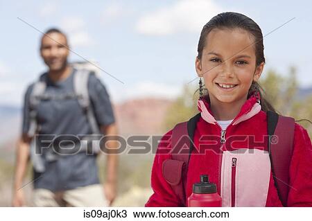 Stock Image - Portrait of girl and her father out hiking, Sedona, Arizona, USA. Fotosearch
