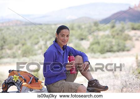 Portrait of mature female hiker with water bottle, Sedona, Arizona, USA View Large Photo Image Stock Photo - Portrait of mature female hiker with water bottle, Sedona, Arizona, USA. Fotosearch