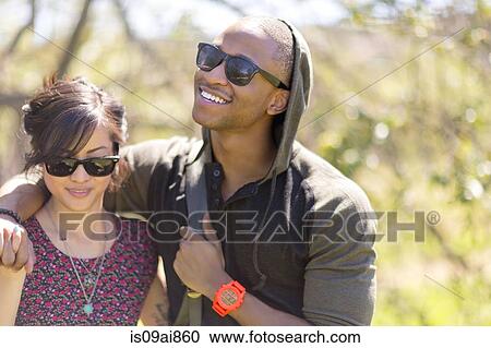 Romantic young couple strolling in woods View Large Photo Image Stock Image - Romantic young couple strolling in woods. Fotosearch