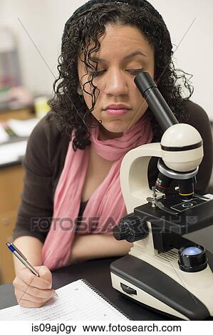 Science student using microscope View Large Photo Image Stock Photo - Science student using microscope. Fotosearch