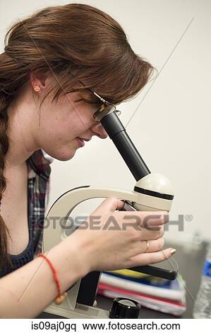 Science student using microscope View Large Photo Image Stock Photography - Science student using microscope. Fotosearch