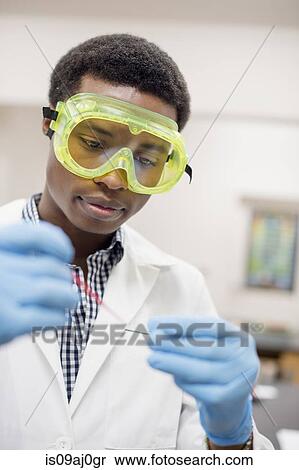 Stock Photography - Science student wearing protective goggles. Fotosearch