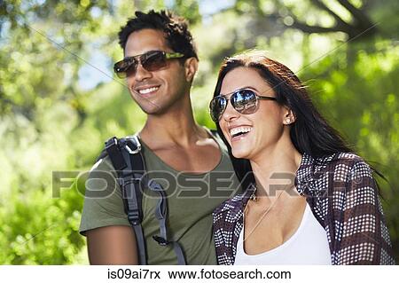 Stock Photo - Smiling couple in woodlands. Fotosearch