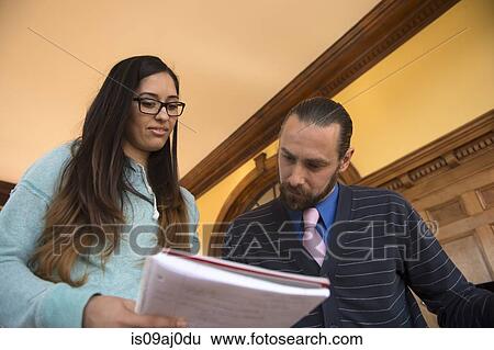 Student showing teacher notbook View Large Photo Image Stock Photograph - Student showing teacher notbook. Fotosearch