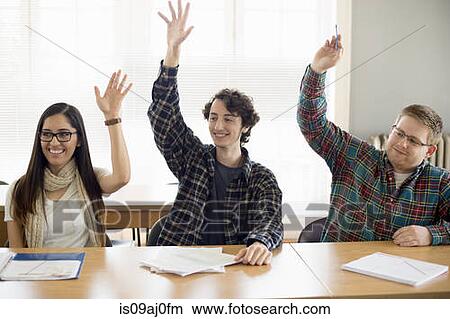 Student with raised hands in classroom View Large Photo Image Picture - Student with raised hands in classroom. Fotosearch