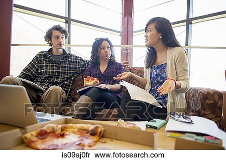Students in common room eating pizza View Large Photo Image Stock Photography - Students in common room eating pizza. Fotosearch