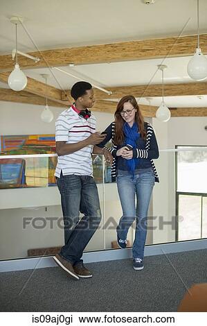 Students standing in corridor View Large Photo Image Stock Image - Students standing in corridor. Fotosearch