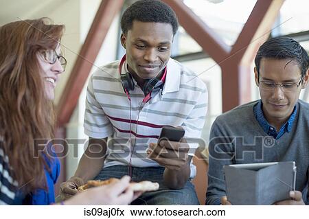 Students using digital tablet and smartphone View Large Photo Image Stock Photo - Students using digital tablet and smartphone. Fotosearch