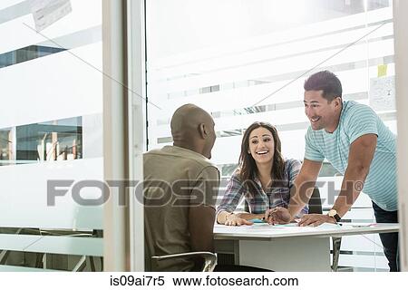 Three business colleagues meeting in office View Large Photo Image Stock Photography - Three business colleagues meeting in office. Fotosearch