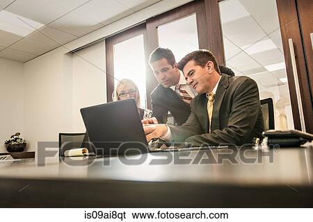 Three business lawyers having a planning meeting in office View Large Photo Image Stock Photograph - Three business lawyers having a planning meeting in office. Fotosearch
