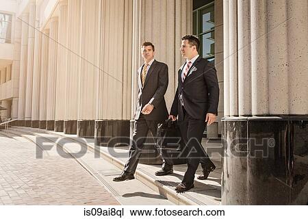 Two business lawyers with briefcase leaving courthouse View Large Photo Image Stock Image - Two business lawyers with briefcase leaving courthouse. Fotosearch