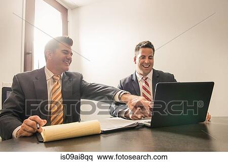 Two male business lawyers chatting in office View Large Photo Image Stock Photography - Two male business lawyers chatting in office. Fotosearch
