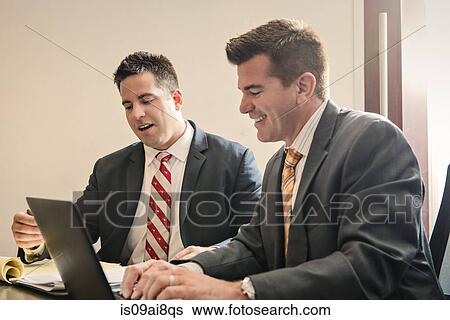 Two male business lawyers having a planning meeting in office View Large Photo Image Stock Photograph - Two male business lawyers having a planning meeting in office. Fotosearch
