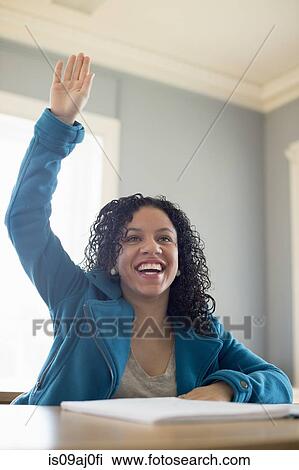 University student with raised hand View Large Photo Image Stock Image - University student with raised hand. Fotosearch